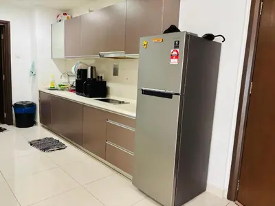 a kitchen with a stainless steel refrigerator at Regalia Skypool KLCC Dorms By Tasrifa in Kuala Lumpur