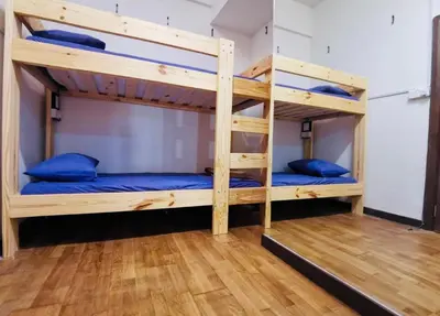 two bunk beds in a room with blue pillows at Regalia Skypool KLCC Dorms By Tasrifa in Kuala Lumpur