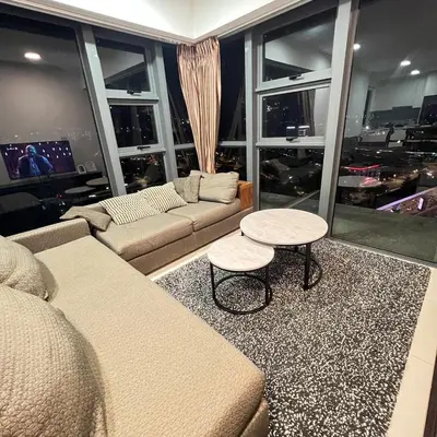 a living room with a couch and a table at EKO CHERAS mall kids play room Big sofa MRT 8 pex in Kuala Lumpur