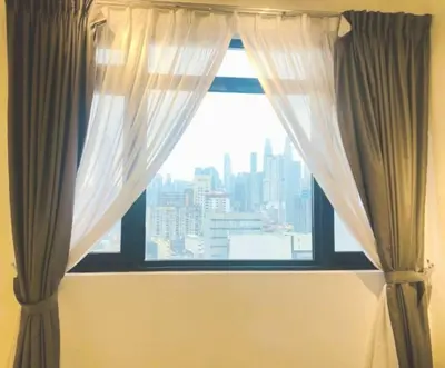 a window with a view of a city at Chambers Kl by MRJ in Kuala Lumpur