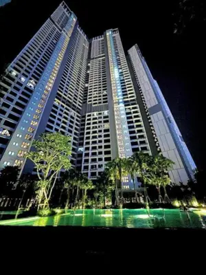 a large building with trees in front of it at Agile SkyView Suites KL in Kuala Lumpur