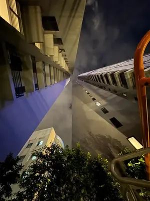 two images of buildings in a city at night at Agile Bukit Bintang by SOD in Kuala Lumpur
