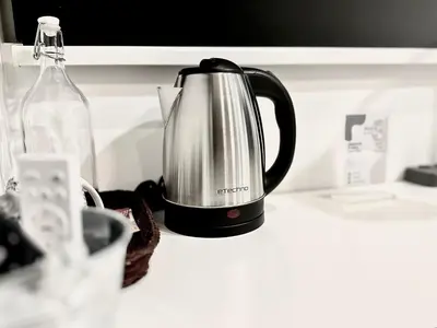 a tea kettle is sitting on a kitchen counter at Studio Room at Neu Suites, Jalan Ampang KL in Kuala Lumpur