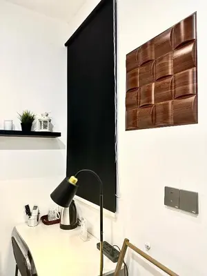 a desk with a lamp on it in a room at Studio Room at Neu Suites, Jalan Ampang KL in Kuala Lumpur