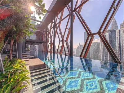 a swimming pool on the top of a building at Scarletz Suites KLCC by WSD in Kuala Lumpur