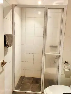 a bathroom with a shower and a toilet at Chamber Residence By SKY Rainbow in Kuala Lumpur