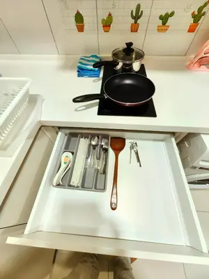 a frying pan sitting on top of a stove in a kitchen at Chamber Residence By SKY Rainbow in Kuala Lumpur