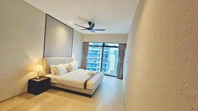 a bedroom with a bed and a ceiling fan at PANORAMIC SUITES at Eaton residence in Kuala Lumpur