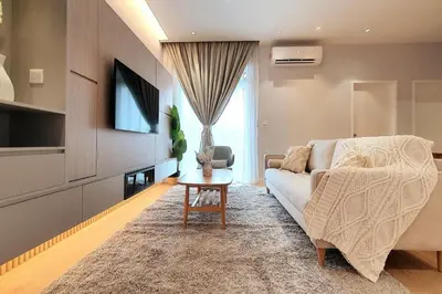 a living room with a couch and a table at TR Residence 2BR KL View Near MRT LRT Monorail in Kuala Lumpur