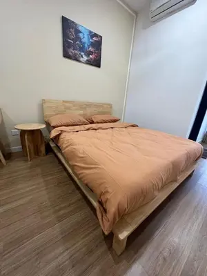 a bedroom with a bed and a table in it at Muji Feel Sunway Velocity 2 Link to Mall 2Br in Kuala Lumpur