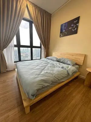 a bed in a bedroom with a large window at Muji Feel Sunway Velocity 2 Link to Mall 2Br in Kuala Lumpur
