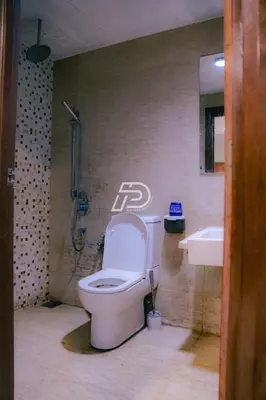 a bathroom with a toilet and a sink at Best View Hostel Regalia KLCC in Kuala Lumpur