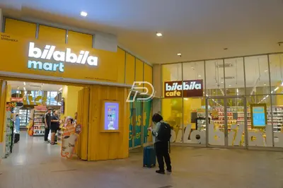 a man standing in front of a shopping mall at Best View Hostel Regalia KLCC in Kuala Lumpur