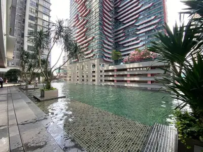 a pool in the middle of a city with tall buildings at Nyiur Premier Residence Ampang Near KLCC Kuala Lumpur in Kuala Lumpur