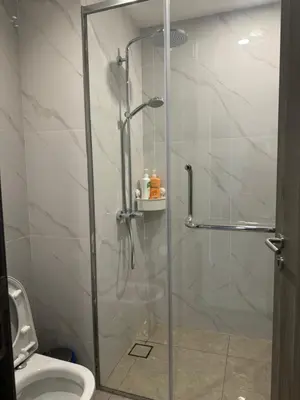 a shower stall in a bathroom with a toilet at Central of KL 1-5px - 10 mins TRX and Bukit Bintang in Kuala Lumpur