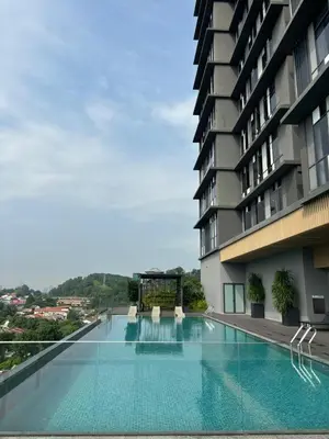 a large swimming pool next to a building at Societe by Bamboo Hospitality in Kuala Lumpur
