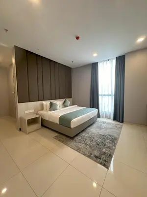 a bedroom with a large bed and a large window at Societe by Bamboo Hospitality in Kuala Lumpur