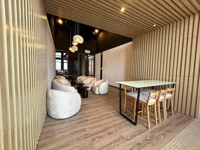 a room with a table and some chairs and a table and a table and chairs at Societe by Bamboo Hospitality in Kuala Lumpur