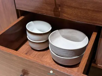 two bowls and plates in a wooden drawer at Japandi Studio w Bathtub - Linked to Quill City Mall in Kuala Lumpur