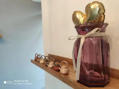a vase with a gold heart sitting on a shelf at Best & Affordable KL Arte Plus 2 bedroom Homestay in Kuala Lumpur