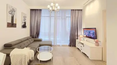 a living room with a couch and a table at Bukit Bintang Fairlane Residence Pavilion KLCC #A25 in Kuala Lumpur
