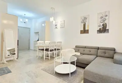 a living room with a couch and a table at Bukit Bintang Fairlane Residence Pavilion KLCC #A25 in Kuala Lumpur