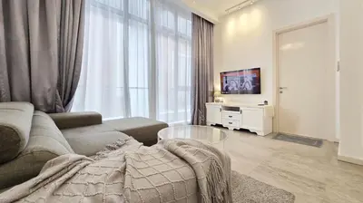 a living room with a couch and a tv at Bukit Bintang Fairlane Residence Pavilion KLCC #A25 in Kuala Lumpur