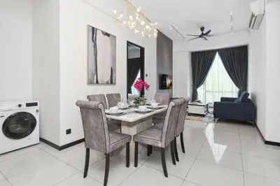 a kitchen and dining room with a table and chairs at KL Panorama in Kuala Lumpur