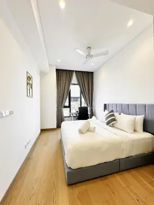 a bedroom with a large bed in a room at Lucentia Global Luxe Suites Kuala Lumpur in Kuala Lumpur