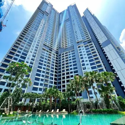 a tall building with a pool in front of it at Agile Bukit Bintang TRX Pavilion KL by WSD in Kuala Lumpur