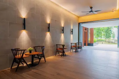 a dining room with chairs and tables and a ceiling at Agile Bukit Bintang TRX Pavilion KL by WSD in Kuala Lumpur
