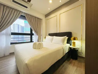 a bedroom with a large white bed with a window at Agile Bukit Bintang TRX Pavilion KL by WSD in Kuala Lumpur