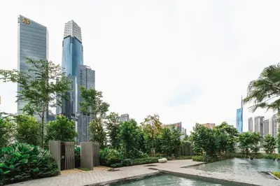 a swimming pool in a city with tall buildings at Woody Studio Agile Bukit Bintang by RumaBnB in Kuala Lumpur