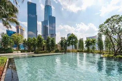 a swimming pool in a city with tall buildings at Woody Studio Agile Bukit Bintang by RumaBnB in Kuala Lumpur