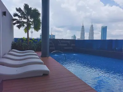a swimming pool on the roof of a building at Eaton Residence KLCC Elite Suites in Kuala Lumpur