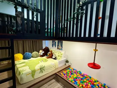 a childs room with a bunk bed with balls at KidsCastle Bukit Bintang Slide Family Friendly in Kuala Lumpur