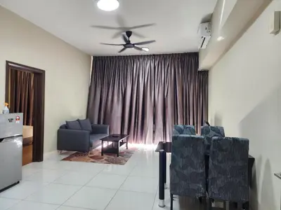 a living room with chairs and a ceiling fan at Regalia Suites Best Couples Studio KLCC in Kuala Lumpur