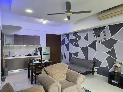 a living room with a couch and a table and a kitchen at Regalia Suites Best Couples Studio KLCC in Kuala Lumpur