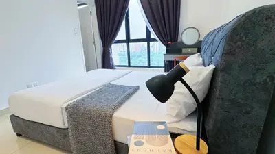 a bedroom with a bed with a lamp and a window at Vista Sentul Residences, 3-Bedroom Fully Air-Con Suite, SENTUL in Kuala Lumpur