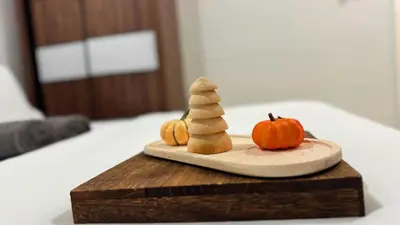 a cutting board with a carving of a pumpkin and pumpkins at Vista Sentul Residences, 3-Bedroom Fully Air-Con Suite, SENTUL in Kuala Lumpur