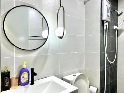 a bathroom with a sink and a mirror at The Elman new home in Setiawangsa in Kuala Lumpur