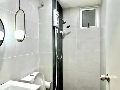 a bathroom with a shower with a toilet and a sink at The Elman new home in Setiawangsa in Kuala Lumpur