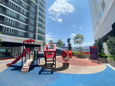 a playground with a slide in front of a building at The Elman new home in Setiawangsa in Kuala Lumpur