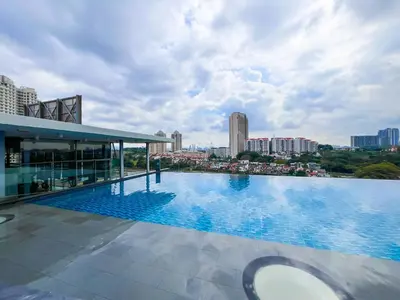a large swimming pool on top of a building at SIgnature Residence - Desa Sri Hartamas - Studio in Kuala Lumpur