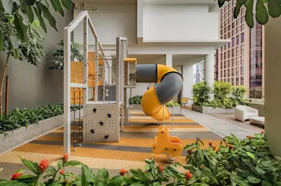 a playground in a building with plants and buildings at Quill Residences by DX in Kuala Lumpur