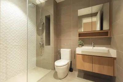 a bathroom with a toilet and a sink and a shower at Quill Residences by DX in Kuala Lumpur