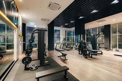 a gym with treadmills and cardio equipment in a building at Quill Residences by DX in Kuala Lumpur