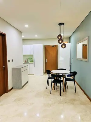 a kitchen and dining room with a table and chairs at Sky Suites KLCC by KD SKY Family Suites in Kuala Lumpur