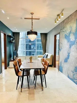 a dining room with a table and chairs at Sky Suites KLCC by KD SKY Family Suites in Kuala Lumpur