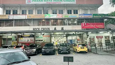 a parking lot with cars parked in front of a building at The Atrium at Jalan Ampang by OKBnB - Cozy 2Bedroom ,3 mins to Foreign Embassies in Kuala Lumpur